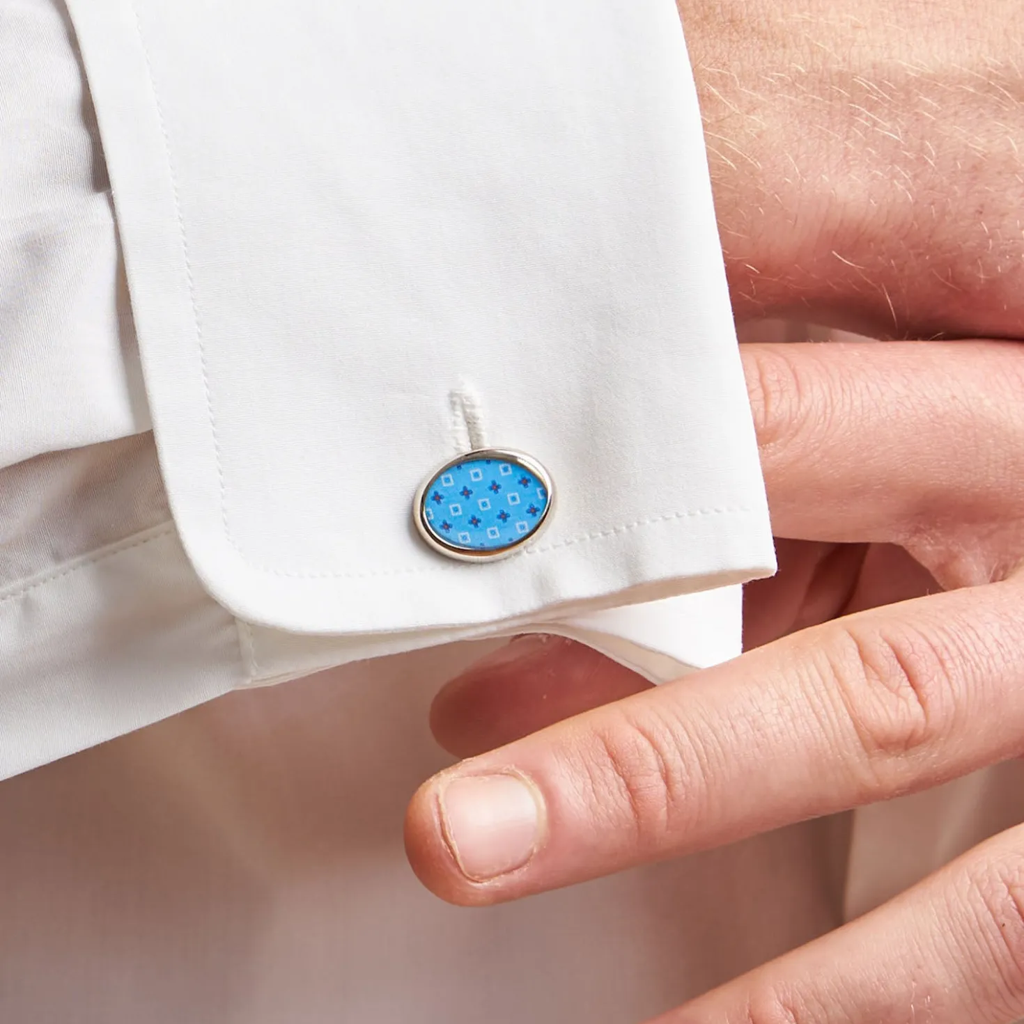 GEMELLI DA POLSO IN ARGENTO AZZURRO Con microfantasia fiore